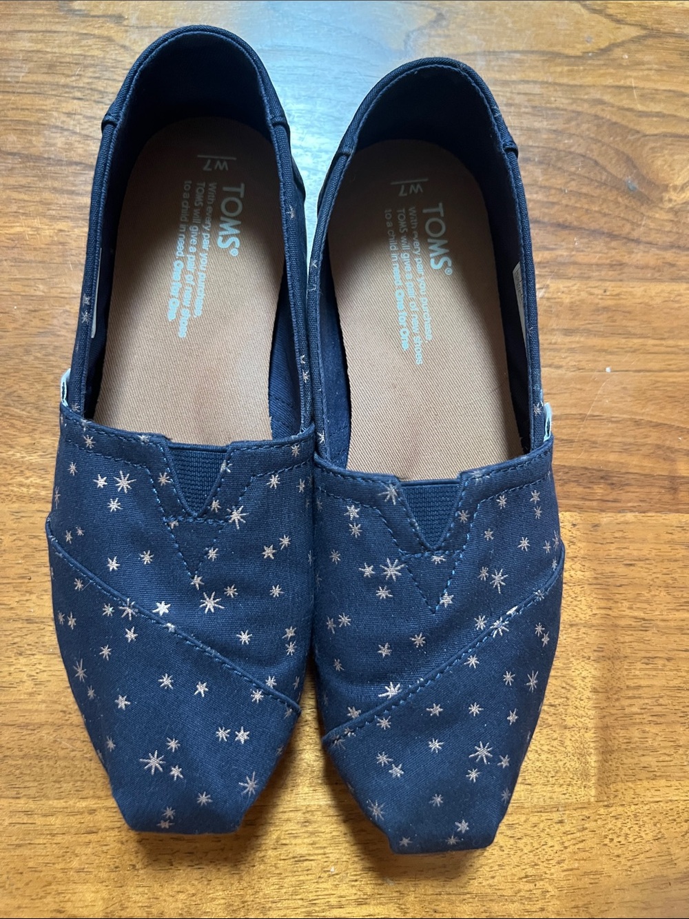 TOMS Navy Canvas Slip-Ons with Star Print. EUC size 7